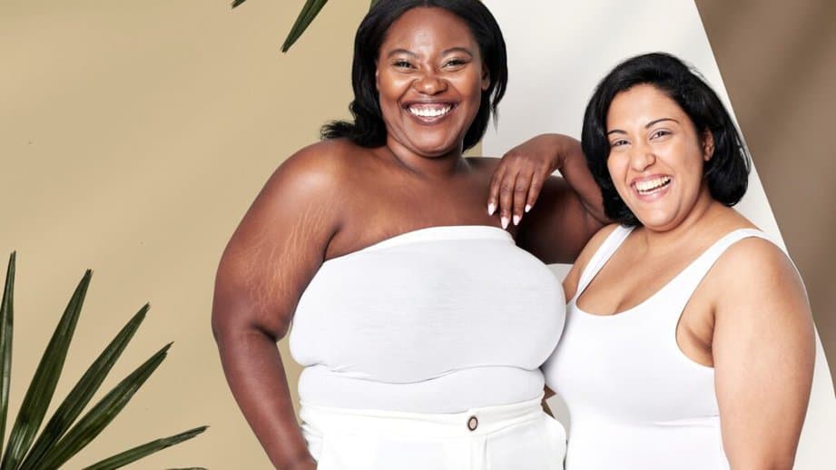 two attractive curvy women in white shirts