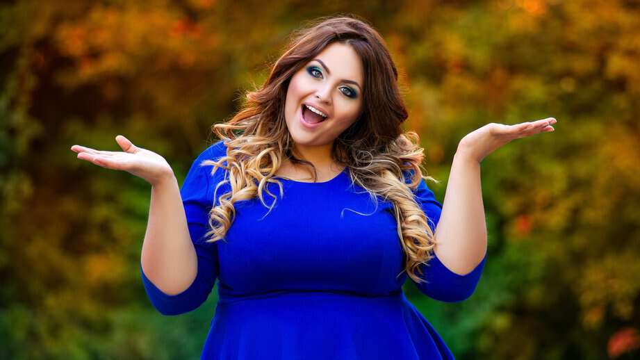 plus sized woman in a blue dress