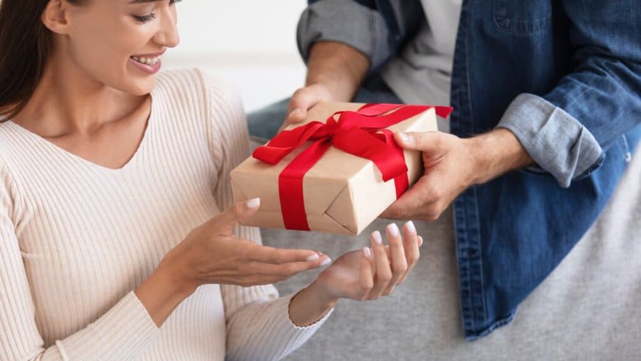 man giving a woman a gift