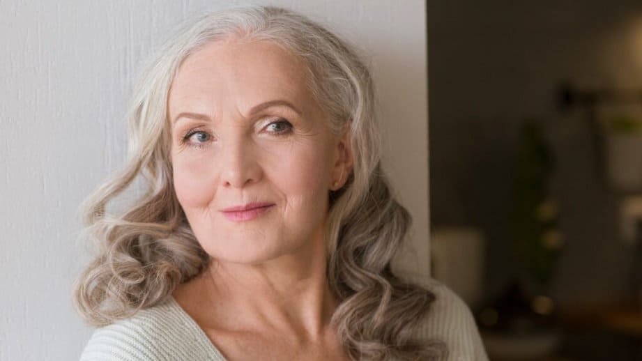 older woman with curly grey hair