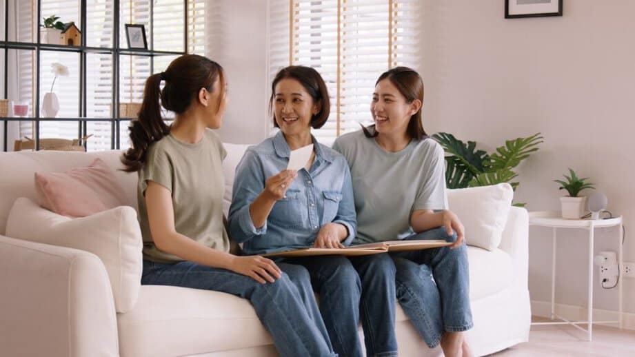 woman showing kids a photo album