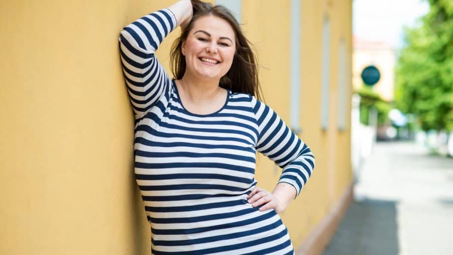 curvy woman in a striped sweater