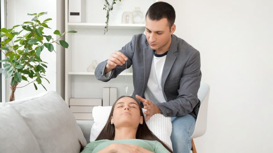 woman laying on couch for hypnotherapy session