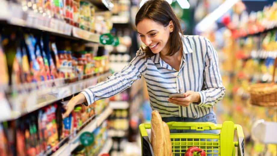 woman shipping for groceries with cart