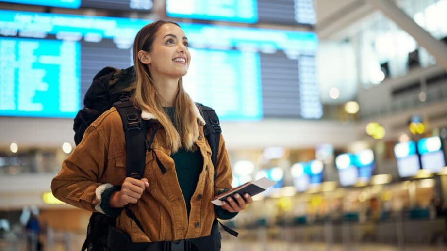 Woman in an airport traveling alone