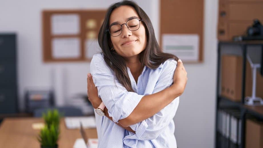 woman giving herslef a hug