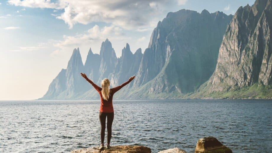 woman alone looking at a mountain