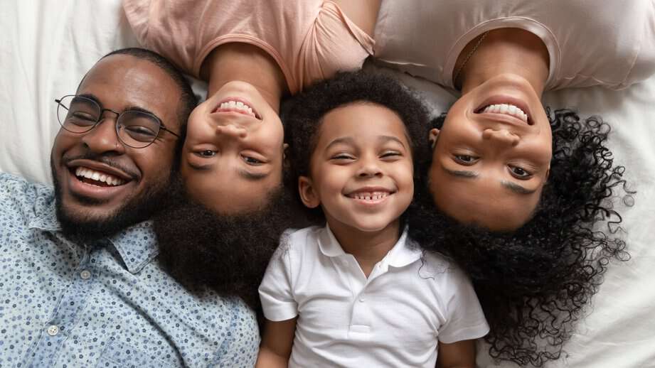 happy family of four smiling