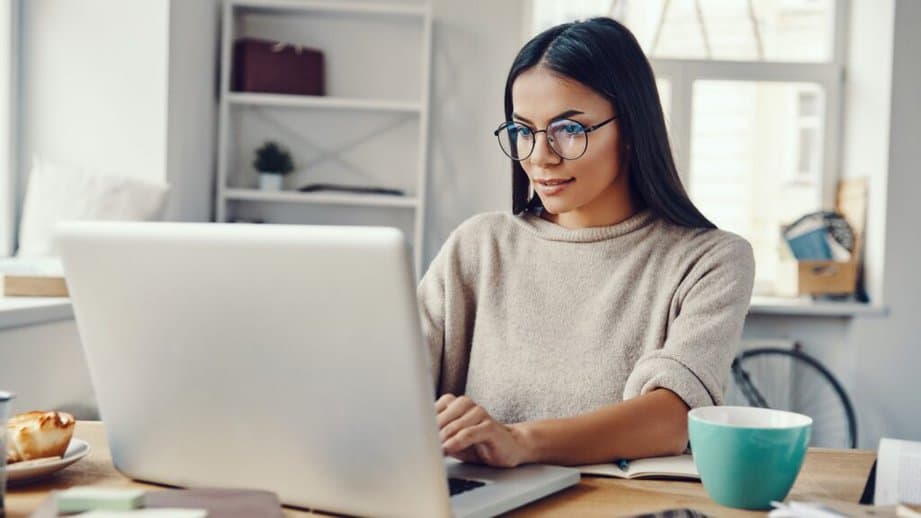 woman working on her computer at home