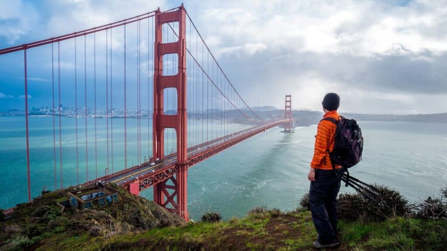 traveler looking at golden gate bridge in san francisco