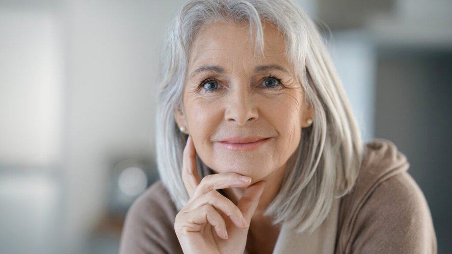 beautiful older woman looking into the camera