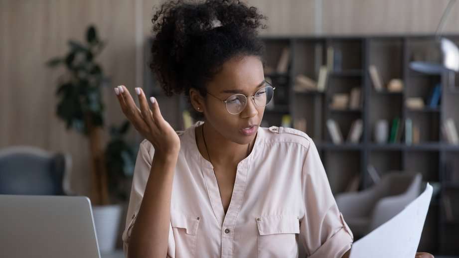 woman confused by paycheck and bills