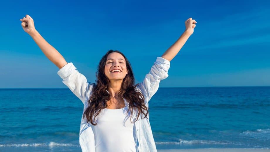 woman who is free from stress at the beach